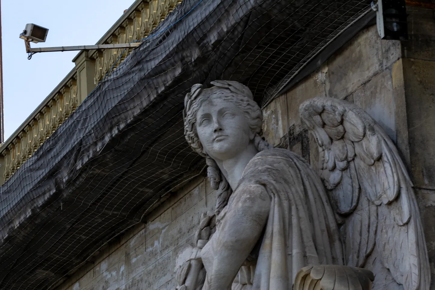 Stone winged figure on the Pont Alexandre III.